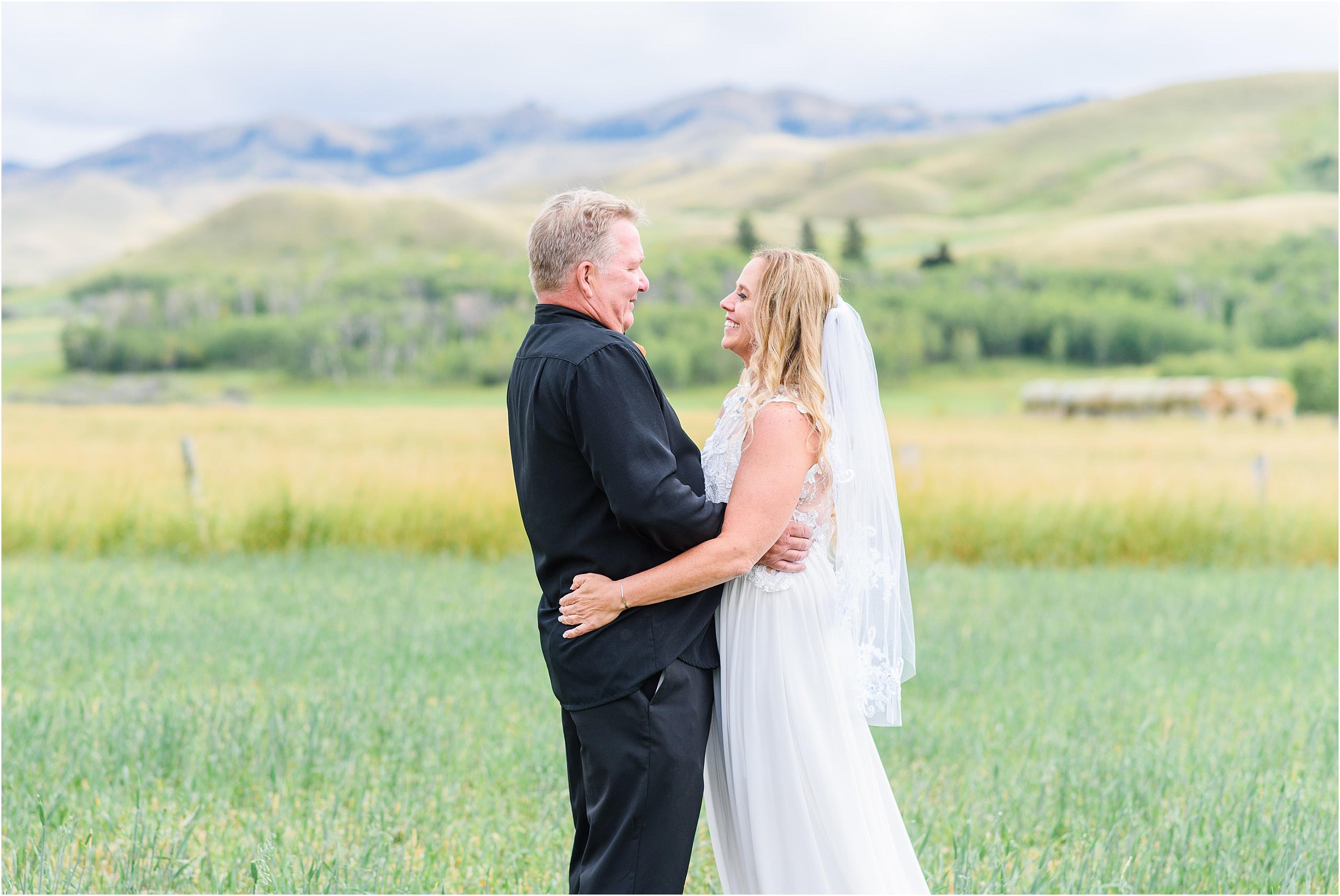 bride and groom taking portraits in mountain montana
