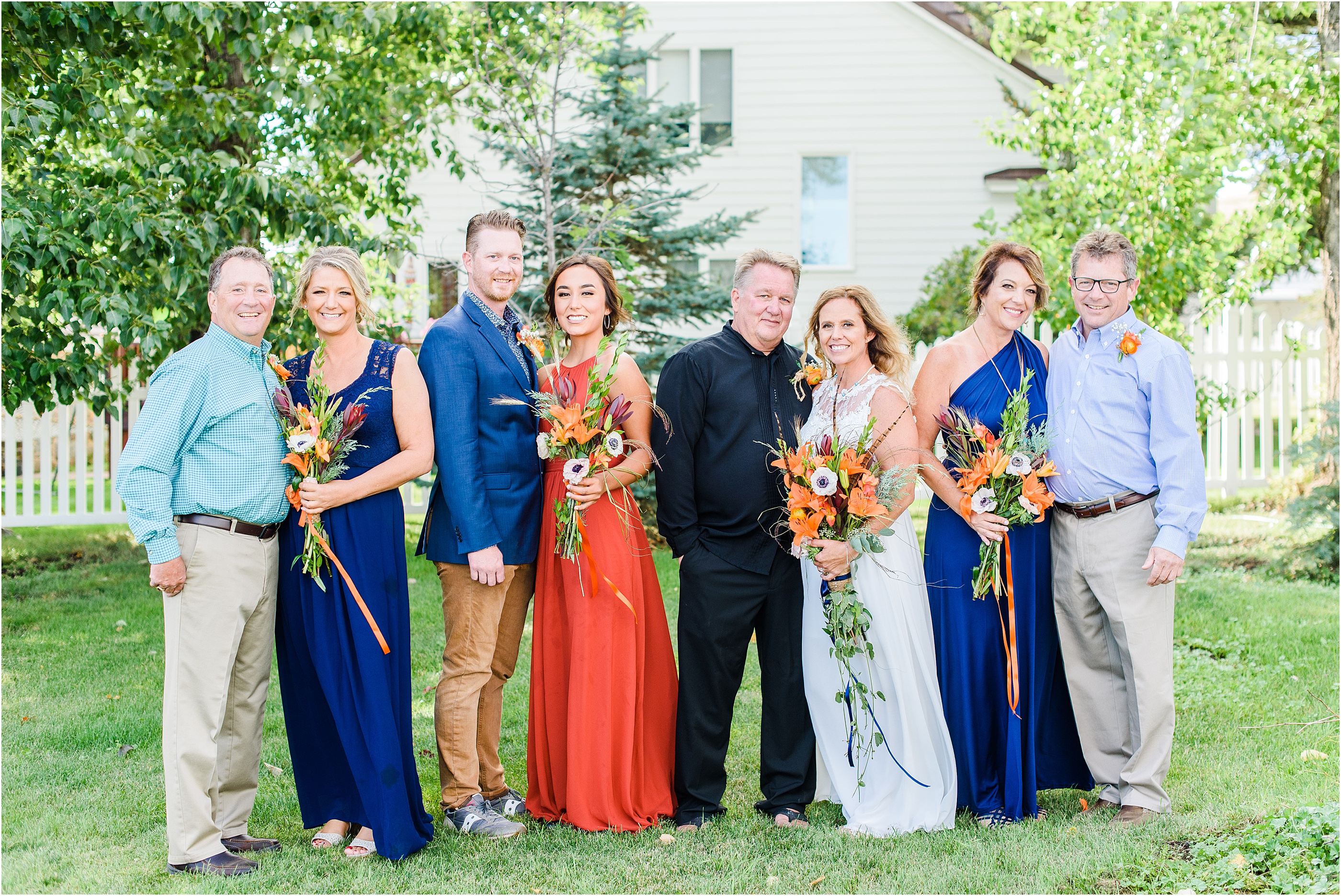bride and groom take family portraits in mountain montana