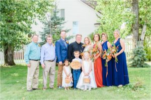 bride and groom take family portraits in mountain montana